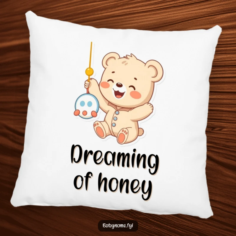 Funny baby bear cub wearing a onesie, reaching up towards a dangling mobile, embodying sweet innocence and humor on a plush pillow cushion.