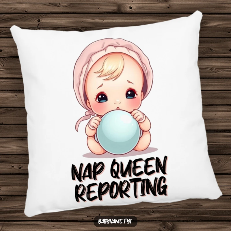 Funny baby peeking out from under a bonnet over a rattle, a soft and funny pillow.