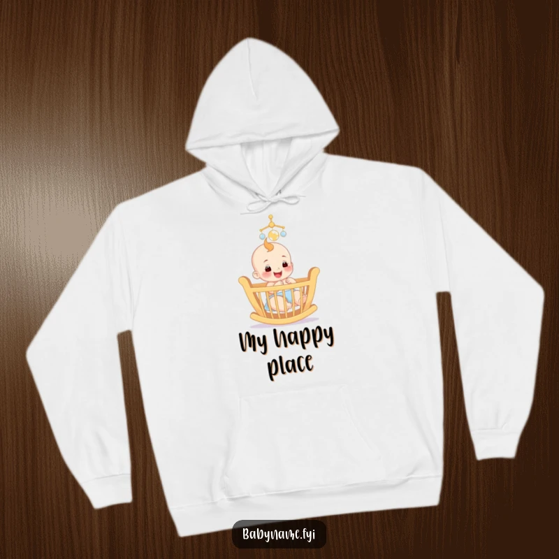 Funny hoodie showing a smiling baby reaching for a colorful mobile above a crib, perfect for cozy baby moments.