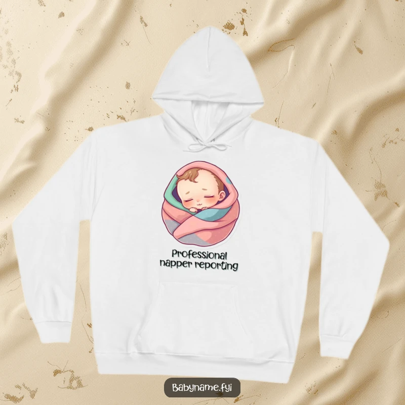 Funny hoodie with a sleeping baby character, looking utterly peaceful and comfortable wrapped in soft, colorful blankets.