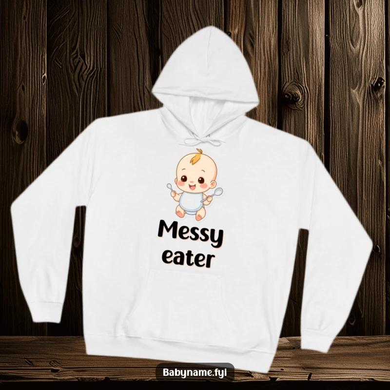 Funny baby hoodie featuring a smiling baby character wearing a bib and holding a spoon. Cozy and humorous apparel for toddlers.