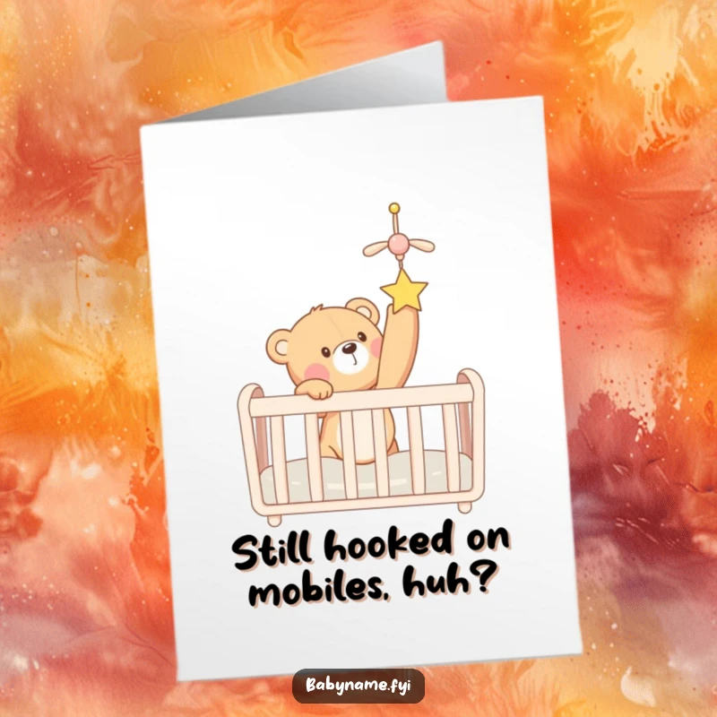 Funny Free Printable Teddy Bear Birthday Card, a cute bear eagerly reaching for a mobile in a crib, perfect for kids.