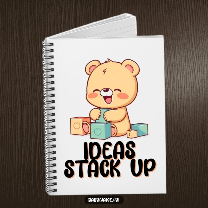 Funny notebook cover illustration of a tiny baby bear character giggling while playing with colorful building blocks, ideal for journaling.