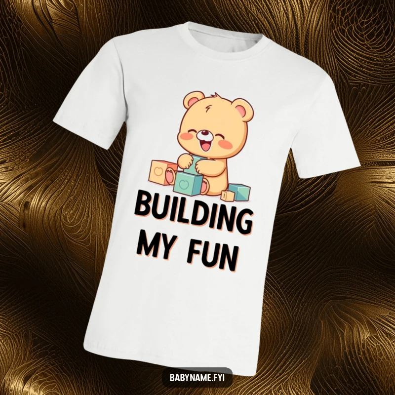 Funny t-shirt graphic of a small, adorable baby bear cub laughing heartily while playing with brightly colored building blocks, full of glee.