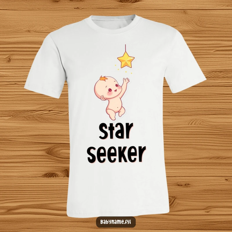 Funny baby reaching up towards a dangling, sparkling star, a whimsical and funny t-shirt.