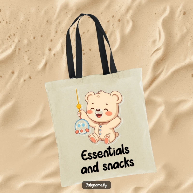 Funny baby bear cub in a onesie, stretching its arms towards a dangling mobile, showcasing delightful innocence on this practical tote bag.
